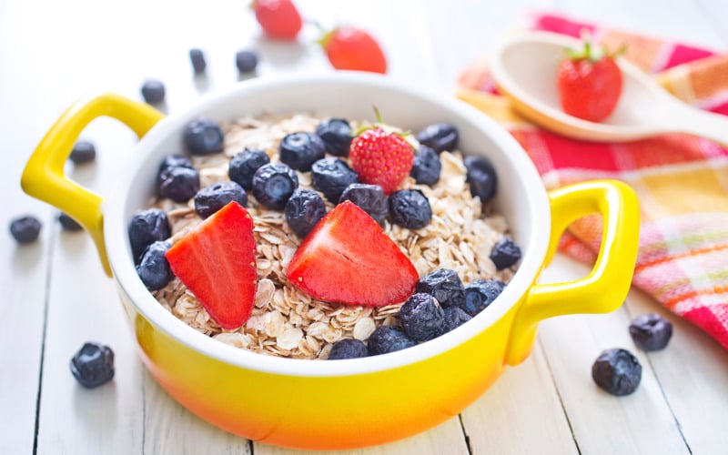 Bowl of oatmeal topped with fresh fruit