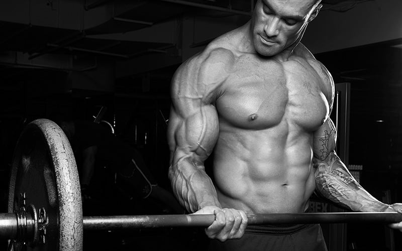 Man Performing Barbell Curls