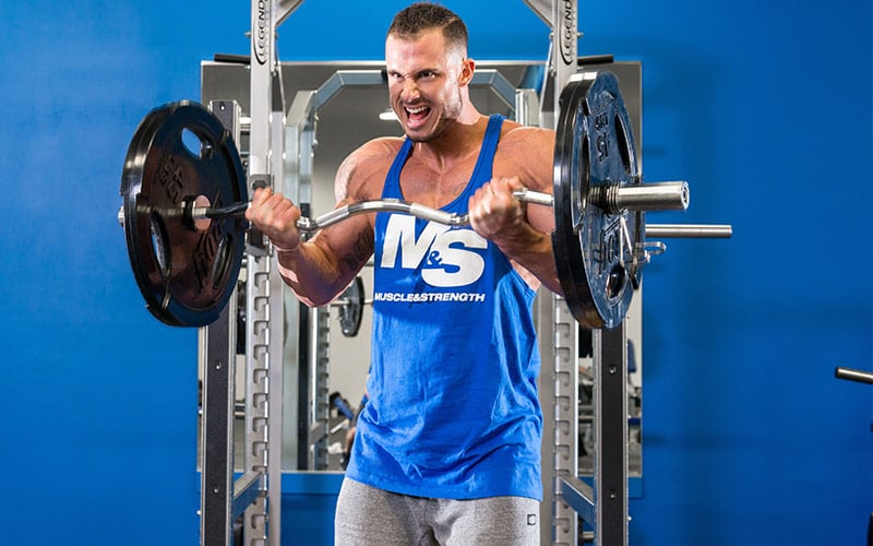 Male Athlete Doing Barbell Curls