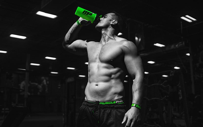 Man Drinking from Blender Bottle