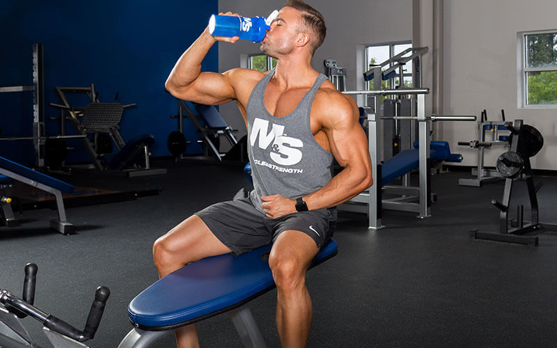 Guy Drinkning from a shaker bottle