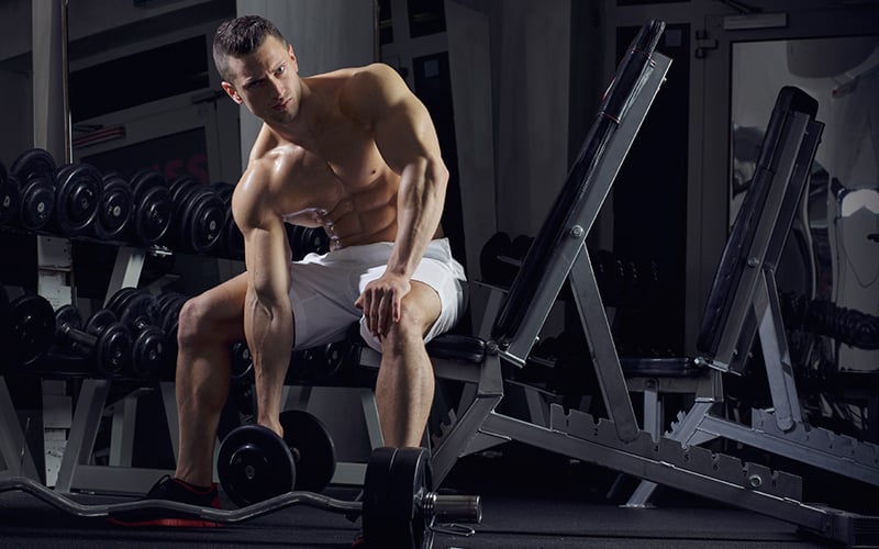 Ripped Man In The Gym With Dumbbell