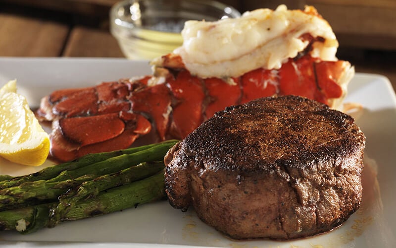 Eating out and enjoying steak and lobster tail