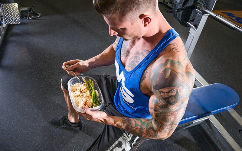 Athlete Eating a Balanced Meal Before Working out