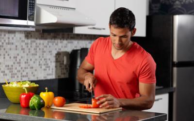 Fit man preparing food in the kitchen