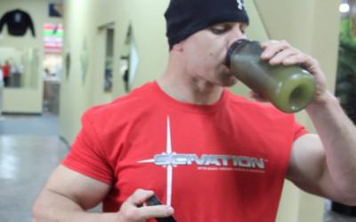 Bodybuilder drinking supplements