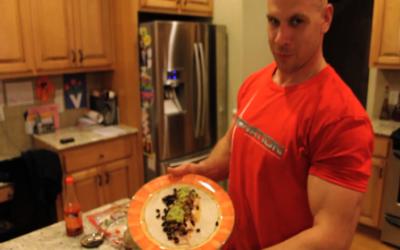Bodybuilder making burritos