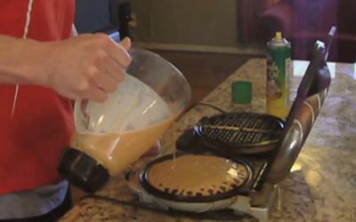Bodybuilder making waffles