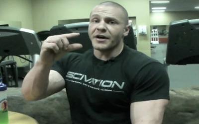 Bodybuilder explaining diet at a table