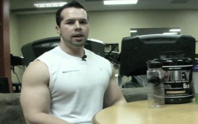 Ripped man sitting at a table