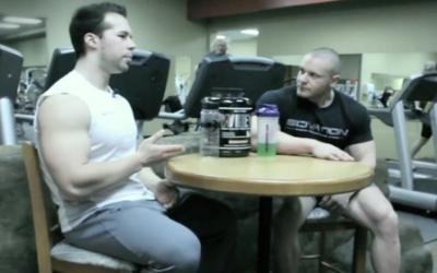Bodybuilders sitting at a table talking