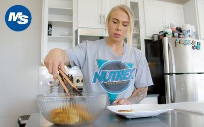 Samantha Jerring in the kitchen flipping her grilled chicken