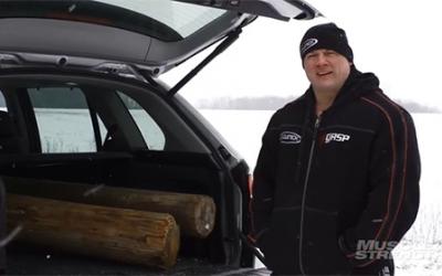 Strongman Matt Kroc standing by car