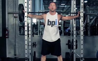 Man doing squat in the gym