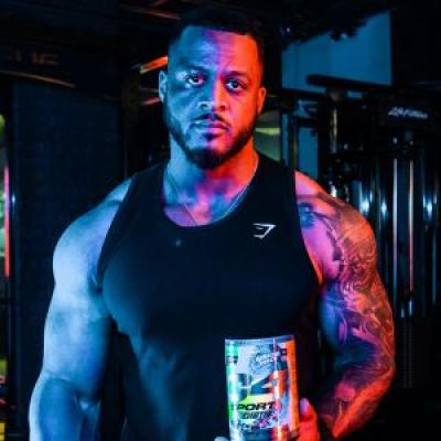 Close up shot of Jamal Browner holding a C4 Sport Strength bottle.