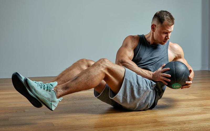 Lean man doing ab workout