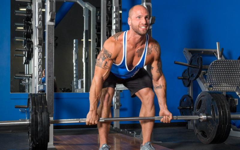 M&S model doing deadlifts in gym.