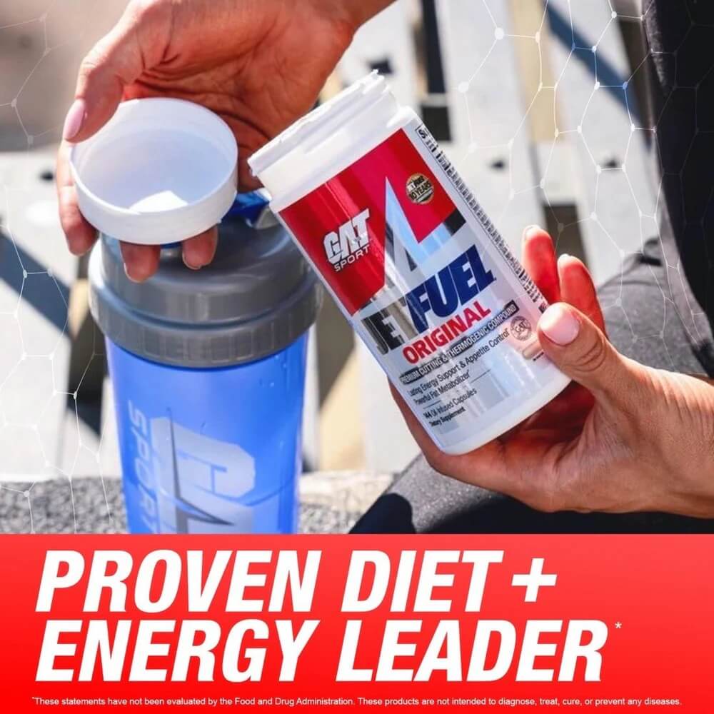 Person holding a tub of Jetfuel Original next to a blue shaker - Proven Diet + Energy Leader