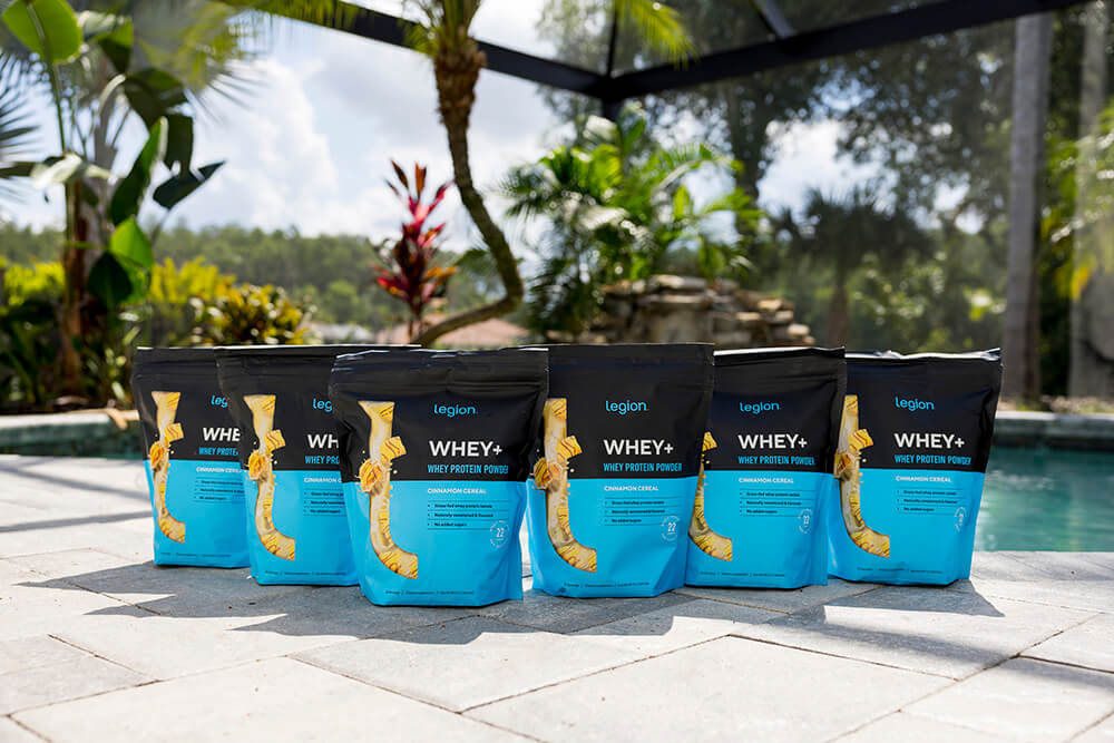Legion Whey+ Cinnamon Cereal bags by a pool