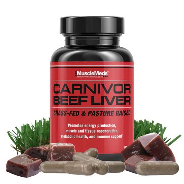 Carnivor Beef Liver bottle on bed of grass with raw beef liver and capsules