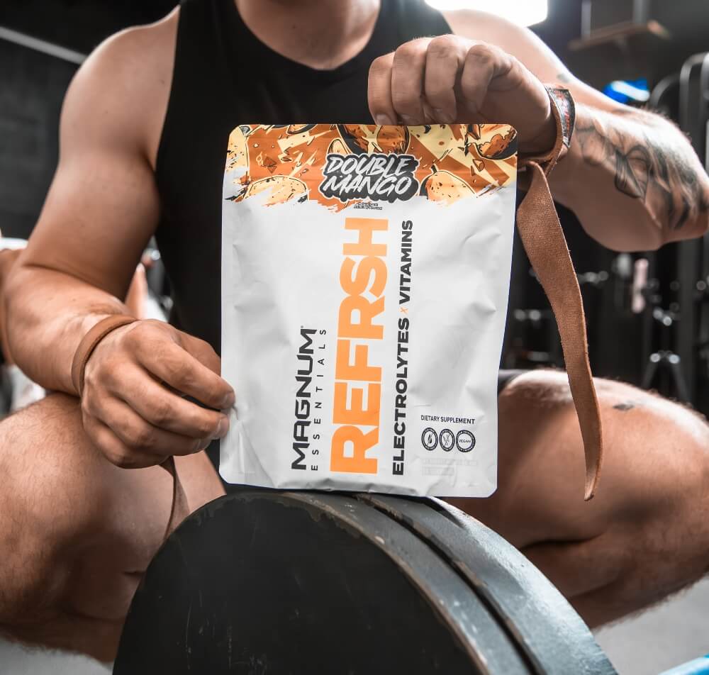 Male athlete holding up Double Mango bag